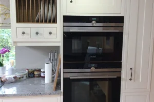 002-1920w-scaled white cabinet with fitted oven and hanging dish organiser