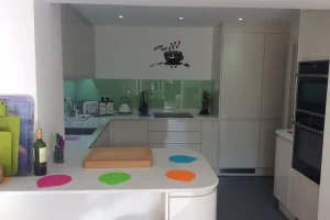 112 white fitted kitchen cabinets with white countertops