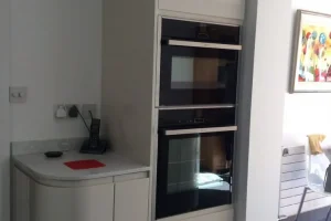 234-1920w-scaled off-white corner cabinet with fitted oven
