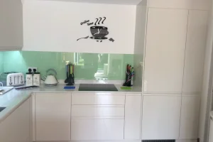 55 fitted kitchen with white cabinets and worktops