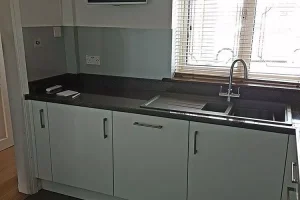 56 fitted kitchen sink with granite worktops and gray cabinets