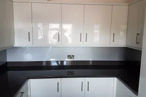 67 white gloss hanging kitchen cabinets with black worktops