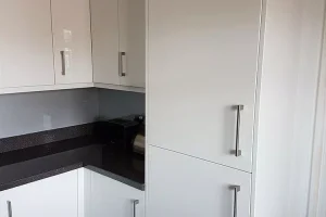 789 white fitted kitchen cabinet with black countertop