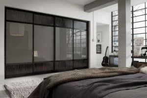 Set10Black-PencilLineDarkSlateGreyMirrorGloss003-1920w bedroom with a bed facing a wardrobe cabinet in pencil line dark slate grey mirrored glossy doors
