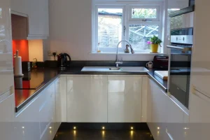 Variouspics203-1920w galley kitchen design in white glossy cabinets and black worktops